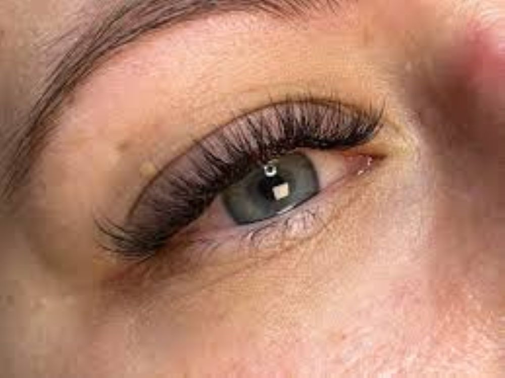 Hybrid eyelash extensions at Sugaring NYC McKinney — dimensional wispy lash result