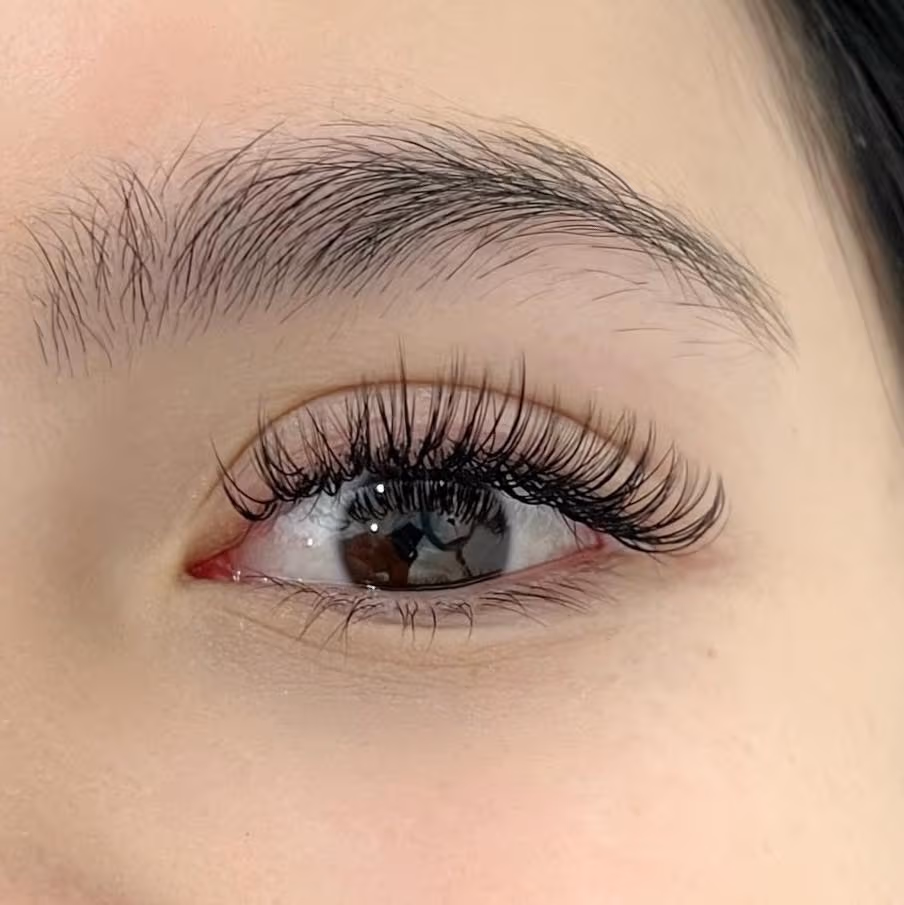 Hybrid lash extensions at Sugaring NYC McKinney TX — full wispy lash result