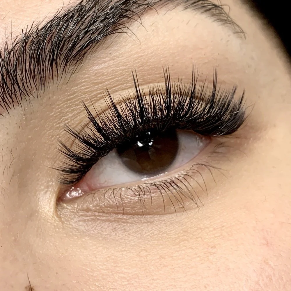 Hybrid lashes at Sugaring NYC McKinney TX — textured open eye lash result
