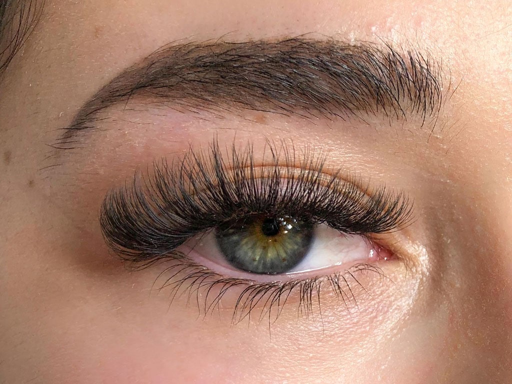 Volume eyelash extensions at Sugaring NYC McKinney — glamorous full lash result